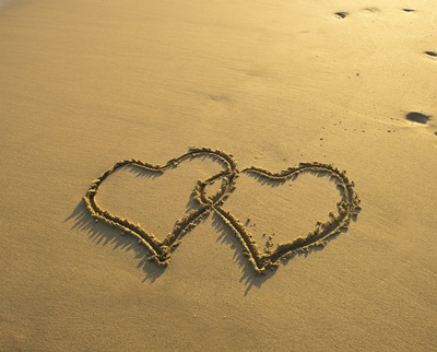 two hearts in sand on a beautiful beach